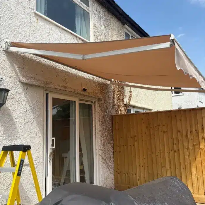 Fully extended manual retractable garden awning providing perfect shade over an Oxford patio.